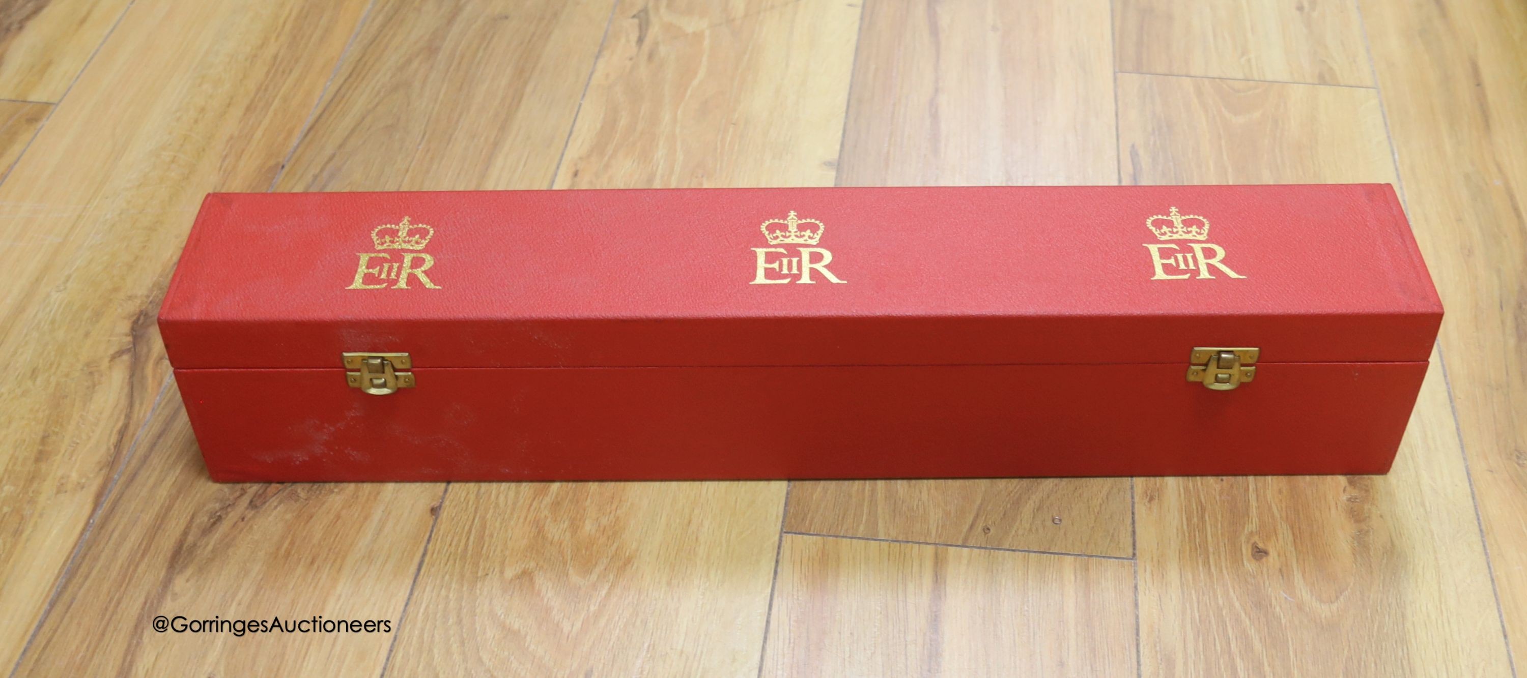 An OBE red block box, 55.5 x 9cm, empty